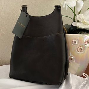 NWT Leather backpack bag. Adjustable straps. Side zip, front magnetic pocket.